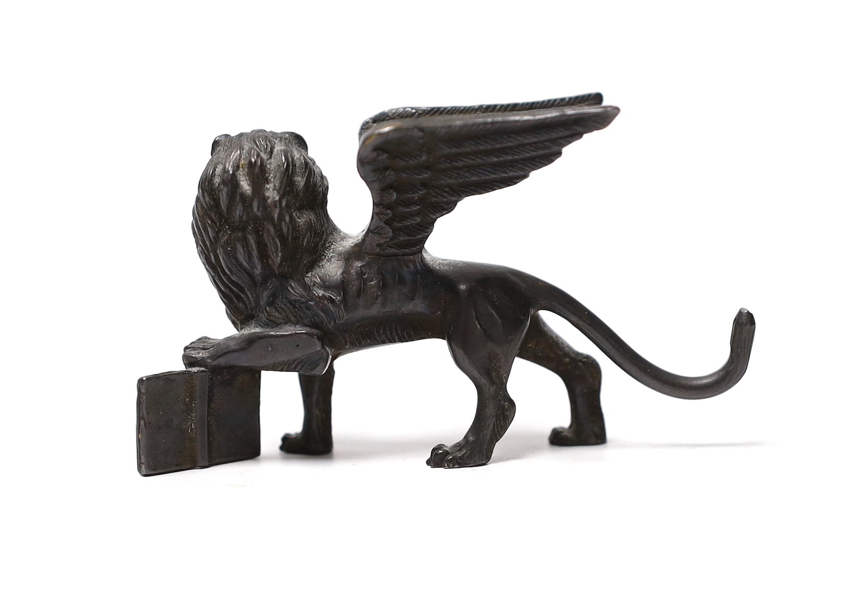 A Grand Tour miniature bronze Winged Lion of St. Mark, late 18th century, 7.5cm wide